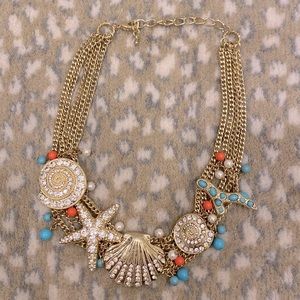 Gold plated coastal theme costume jewelry necklace.